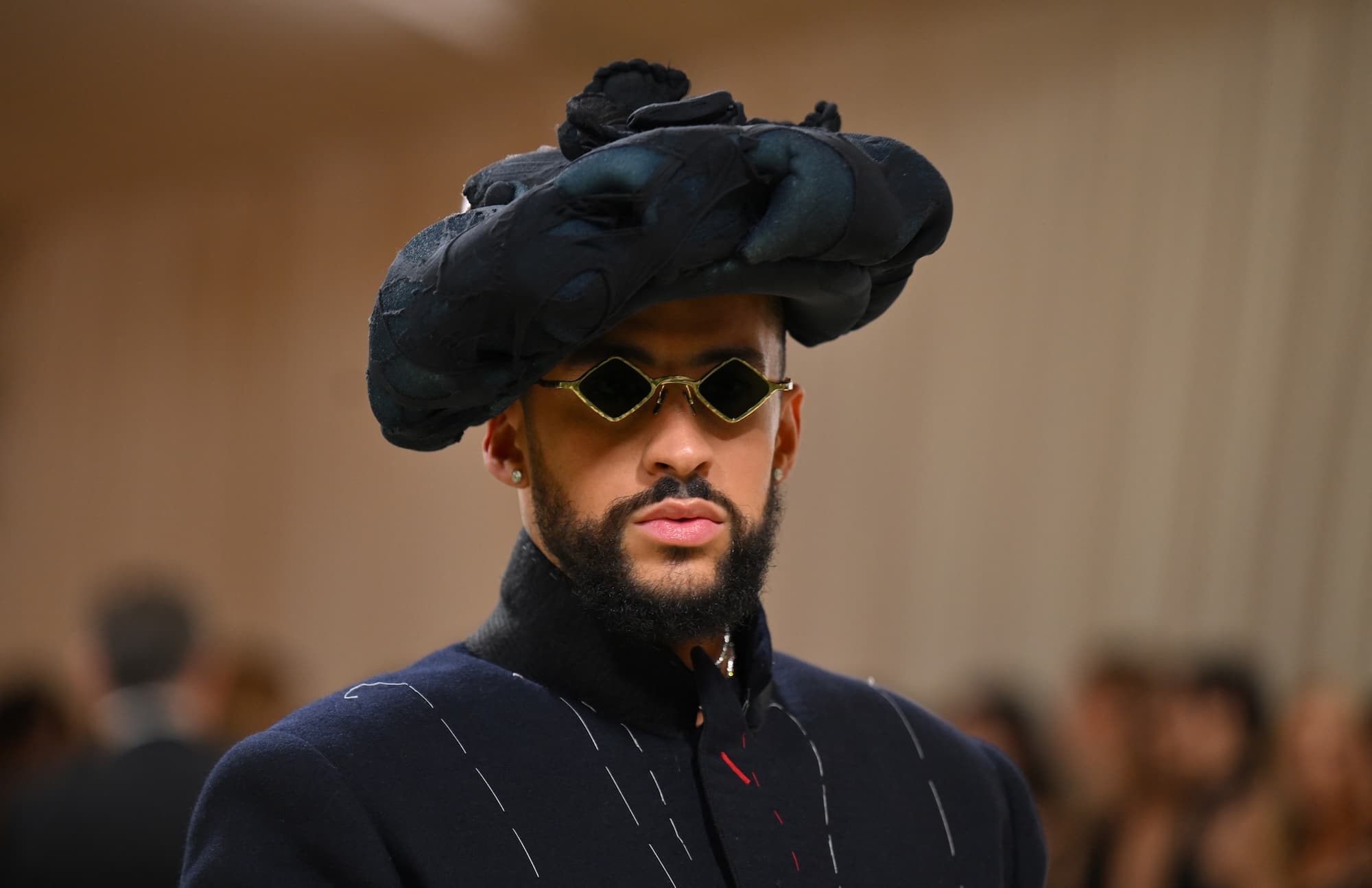 Puerto Rican singer Bad Bunny arrives for the 2024 Met Gala at the Metropolitan Museum of Art on May 6, 2024, in New York. The Gala raises money for the Metropolitan Museum of Art's Costume Institute. The Gala's 2024 theme is ìSleeping Beauties: Reawakening Fashion.î (Photo by Angela WEISS / AFP)
